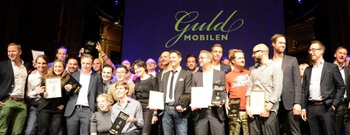 caption: Truecaller Team members standing amongst other Guldmobilen winning companies