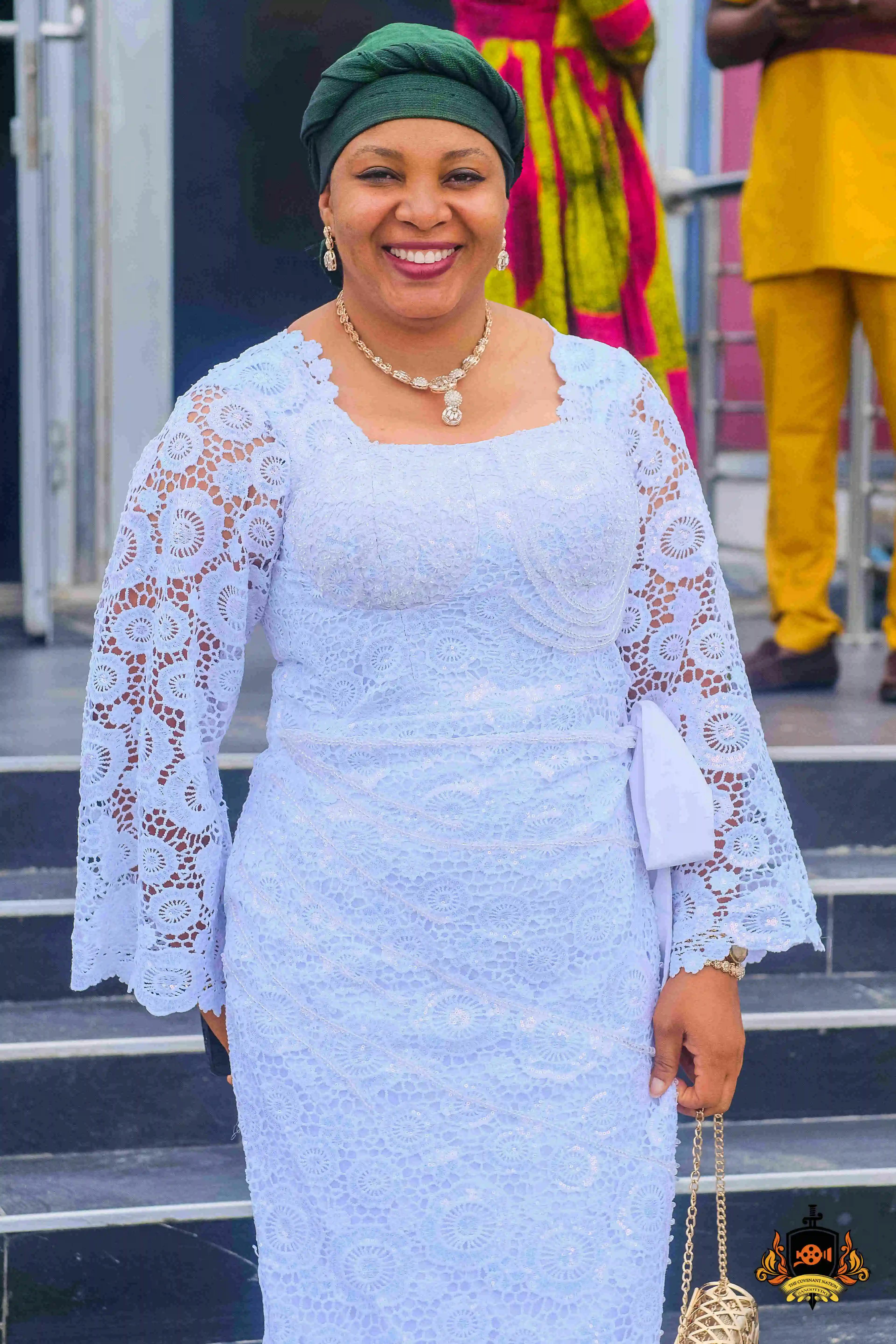 woman wearing white lace and smiling