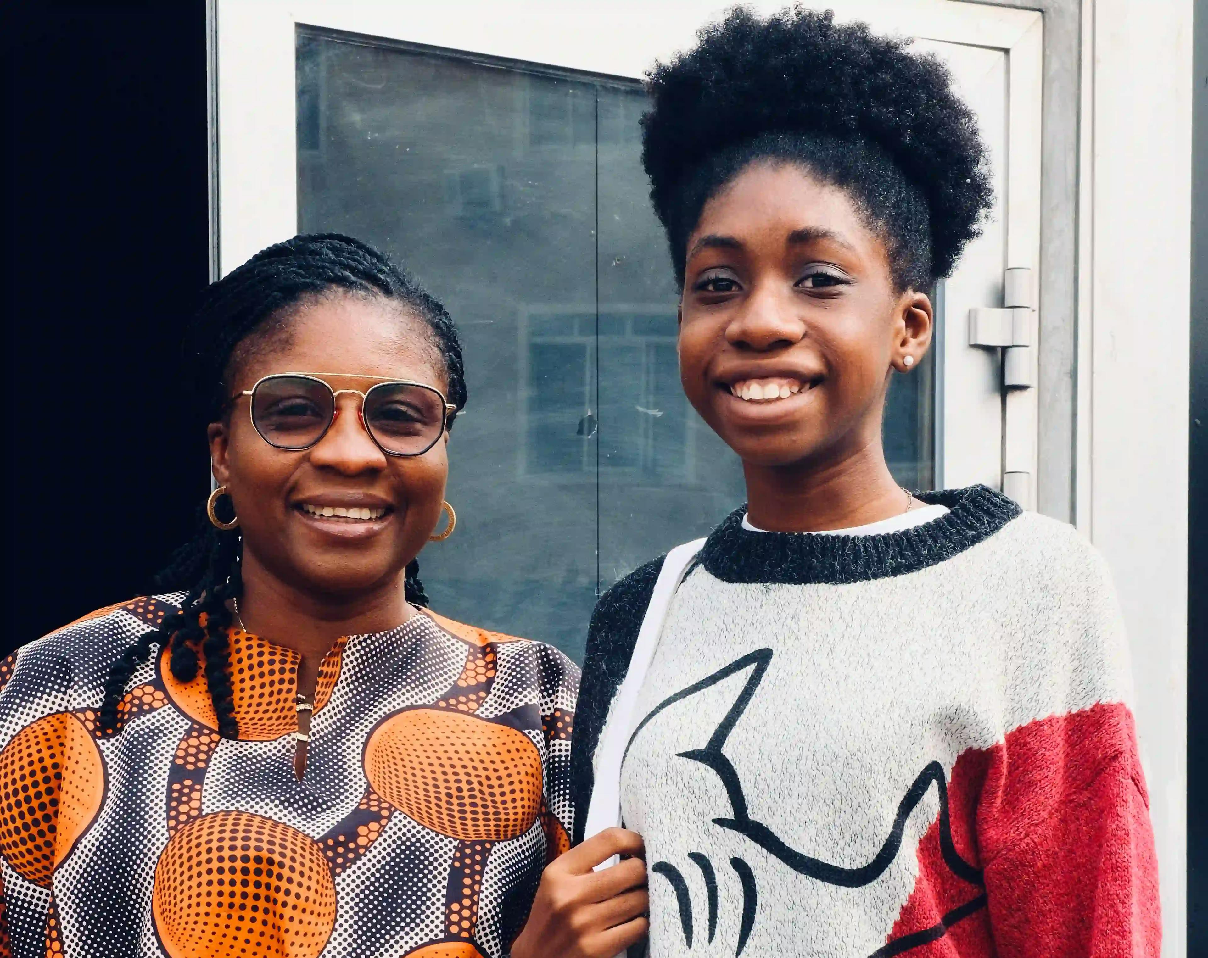 mother and daughter posing