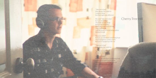 Album liner artwork & lyrics for Cherry Tree Hill. Tom sits looking at a computer screen, wearing headphones.