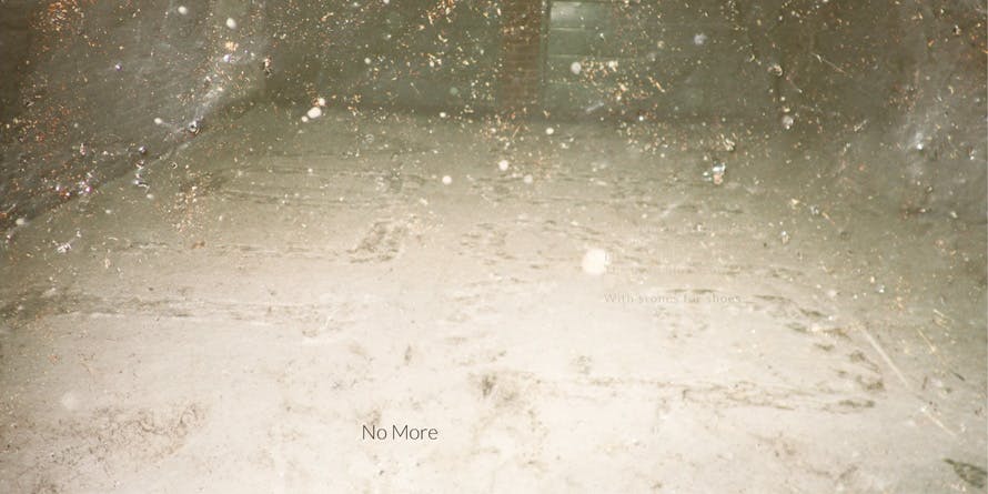 Album liner artwork for No More. A snowy scene with footstep imprints left behind.