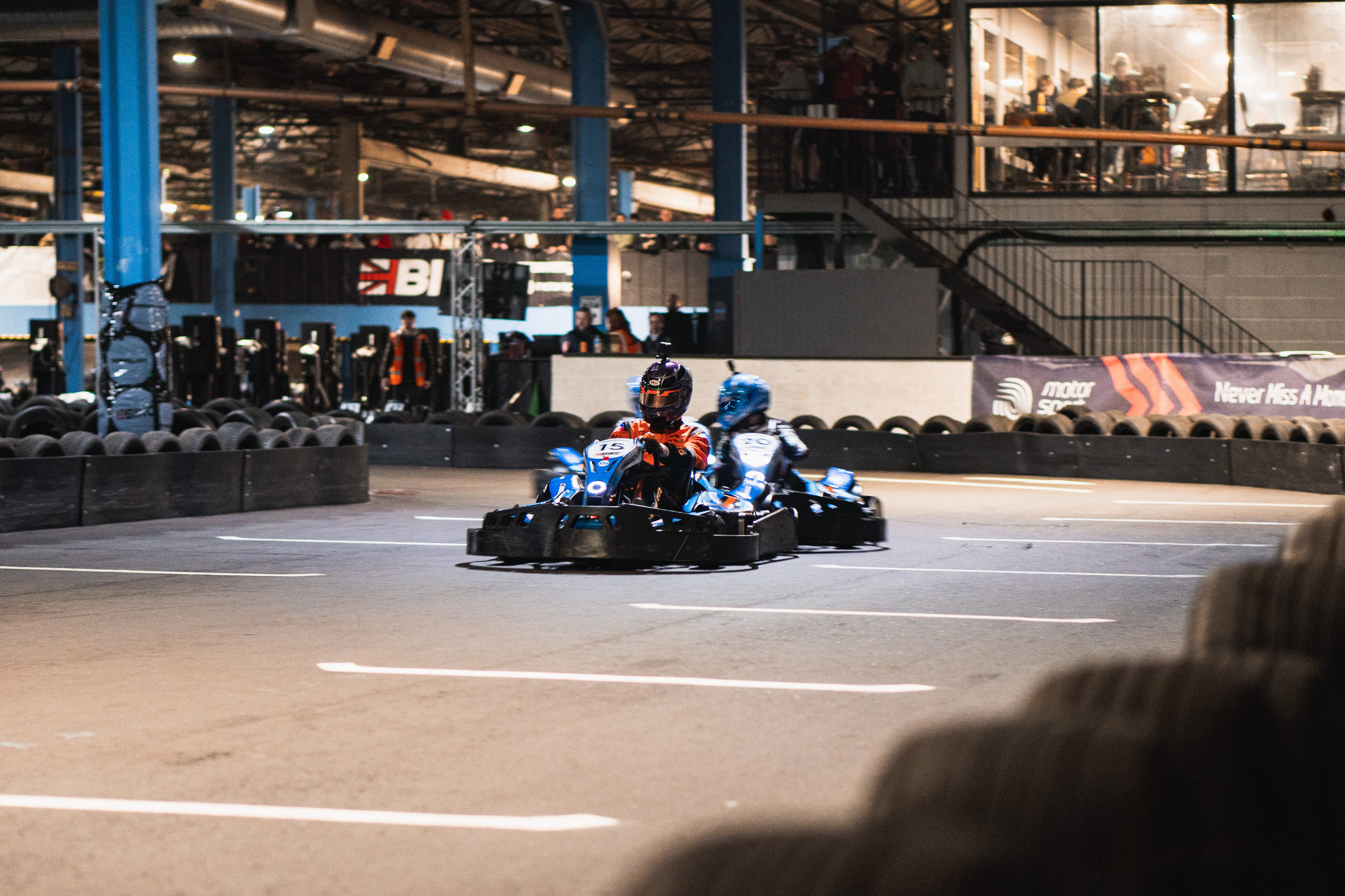 Go-kart racers defending position during a race