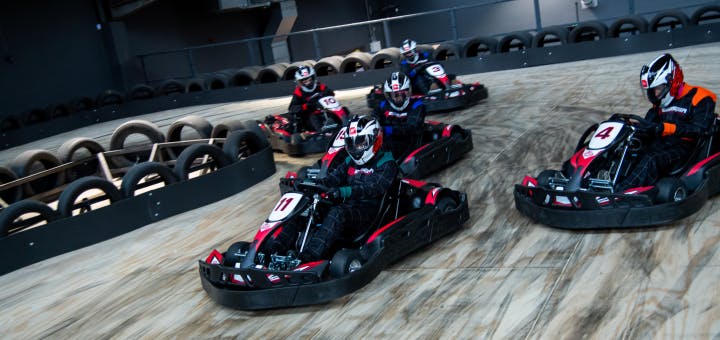 Petrol go karts cornering in a race