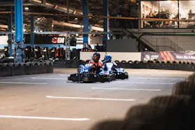 Go-kart racers defending position during a race