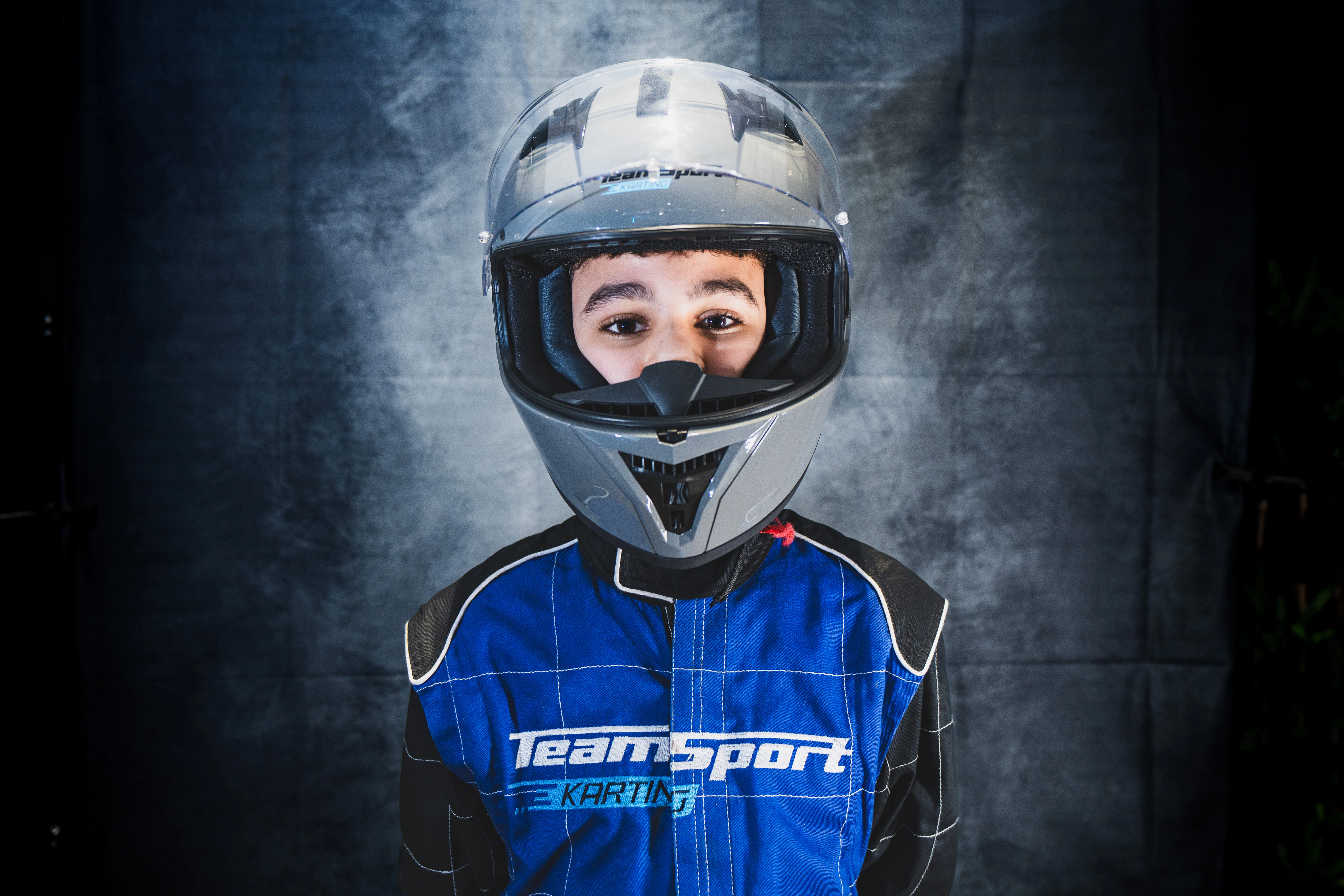 TeamSport members racing on an indoor go-kart track