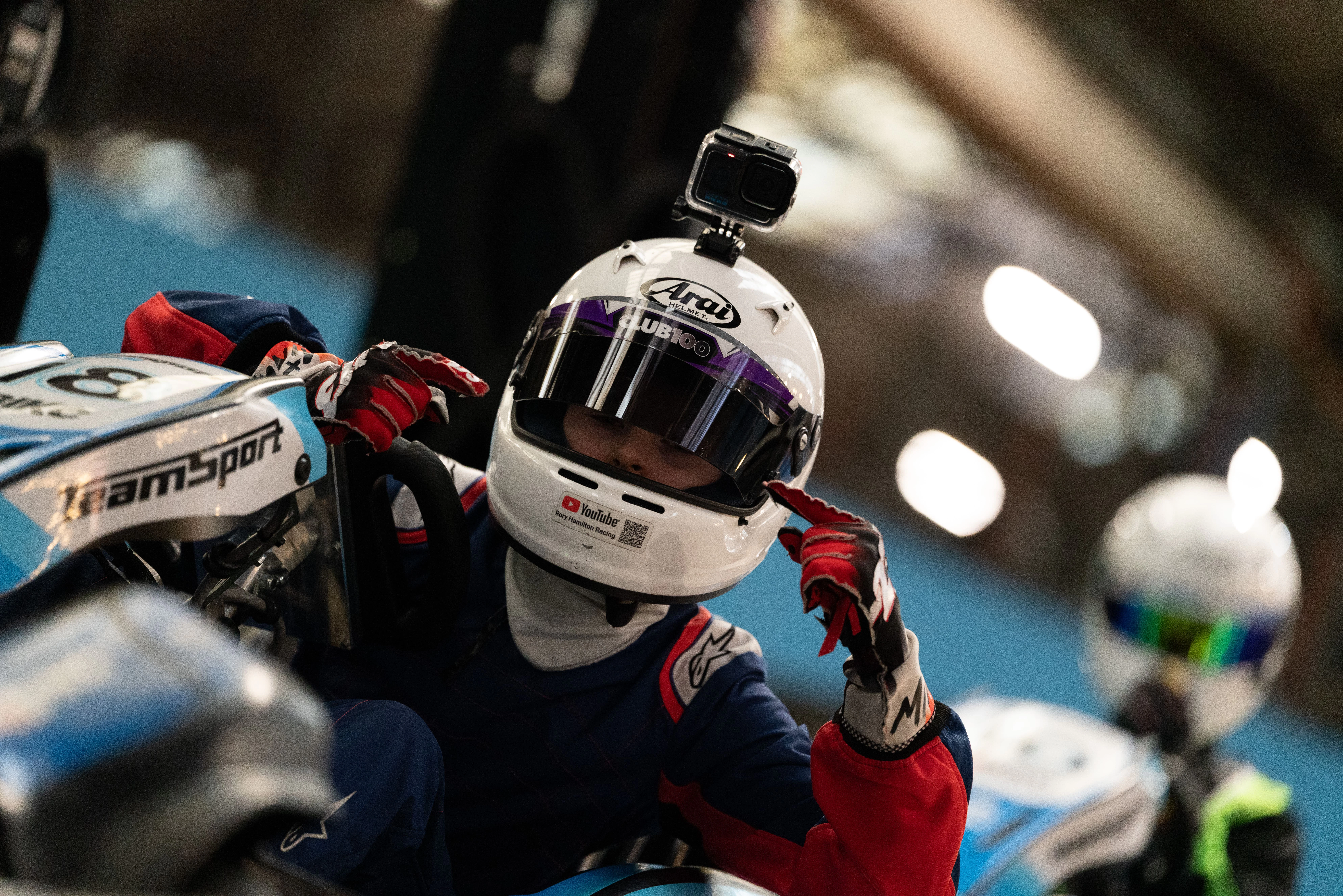 Go-kart racer staying focused during an indoor kart race