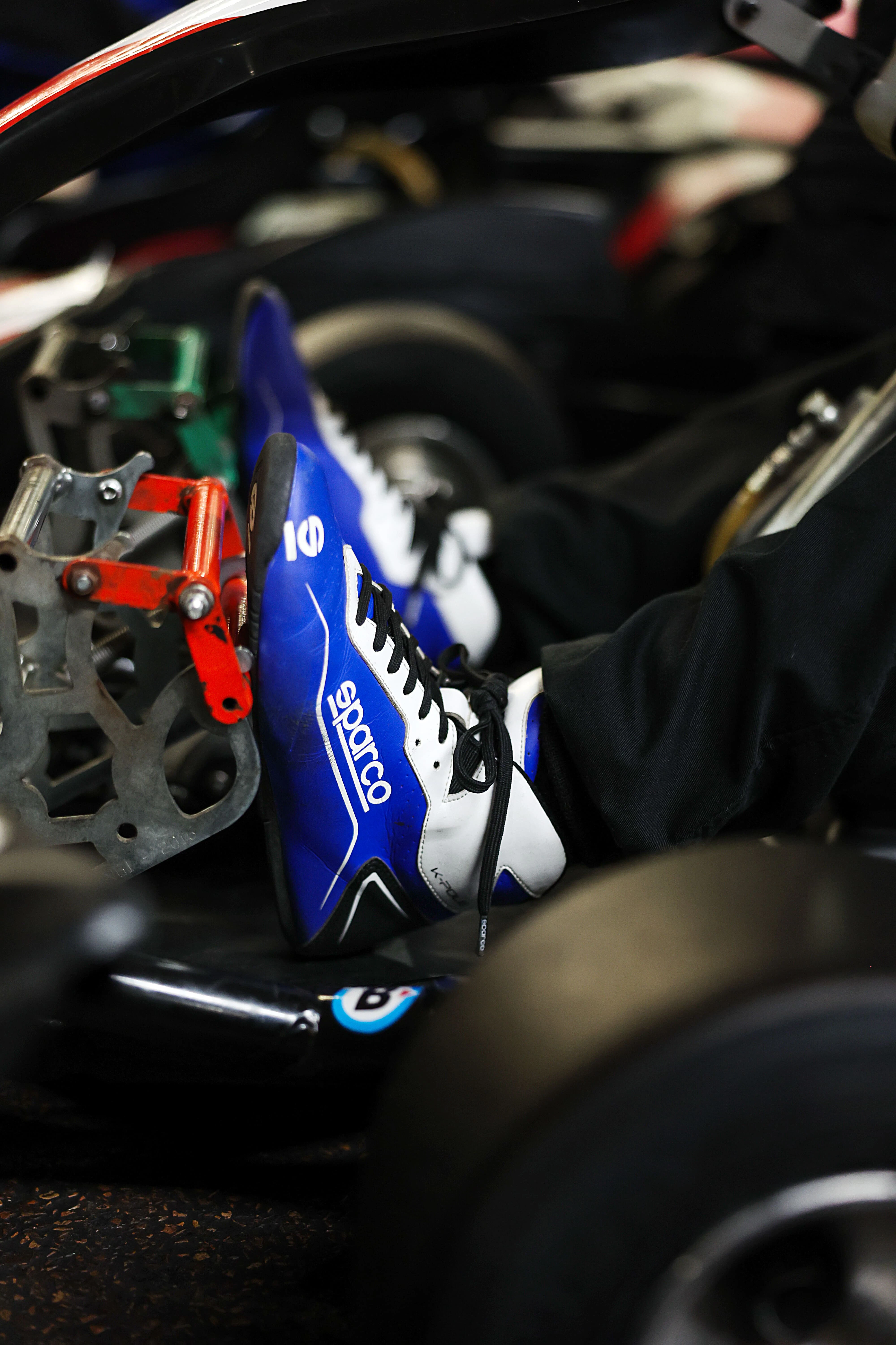 TeamSport members racing on an indoor go-kart track
