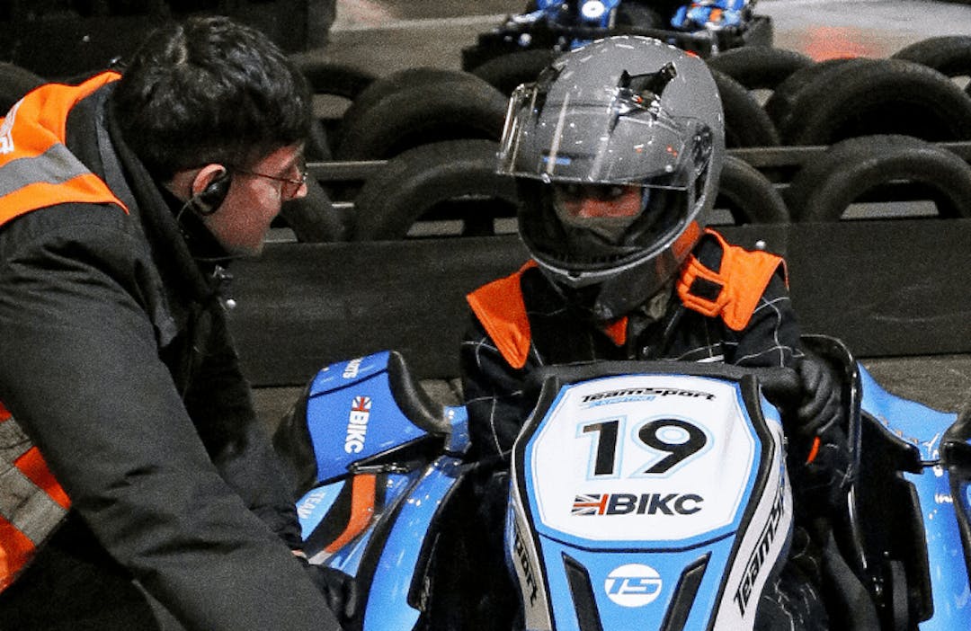 Marshal helping karter in go-kart