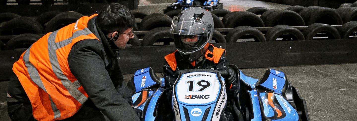 Marshal helping karter in go-kart