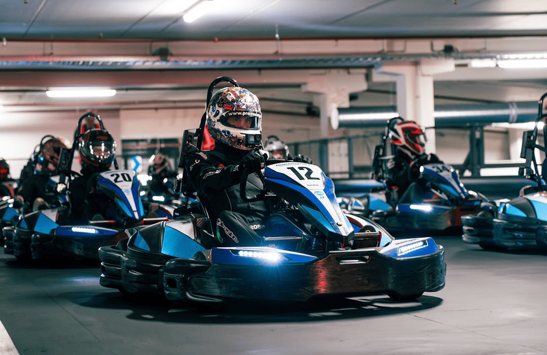 Members in Go Karts lined up on the Grid