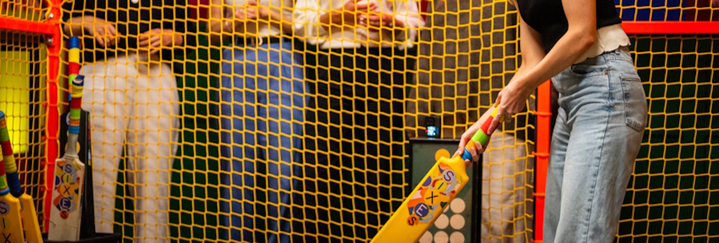 Girl Playing Sixes Cricket at TeamSport Docklands