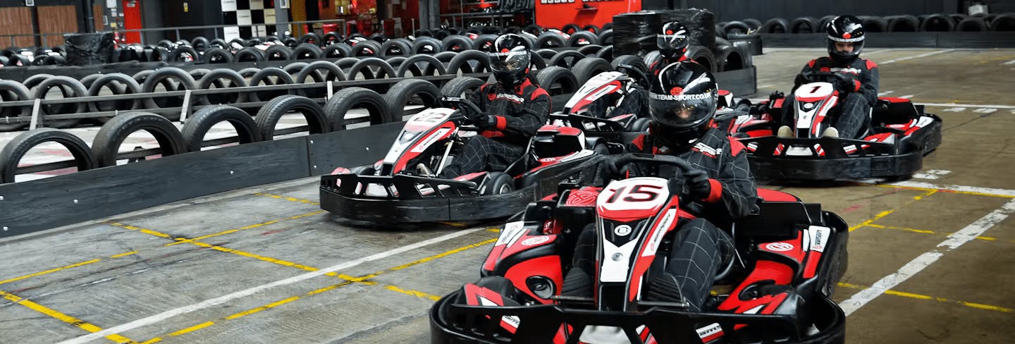 Go-Karting On TeamSport Track In Red Karts
