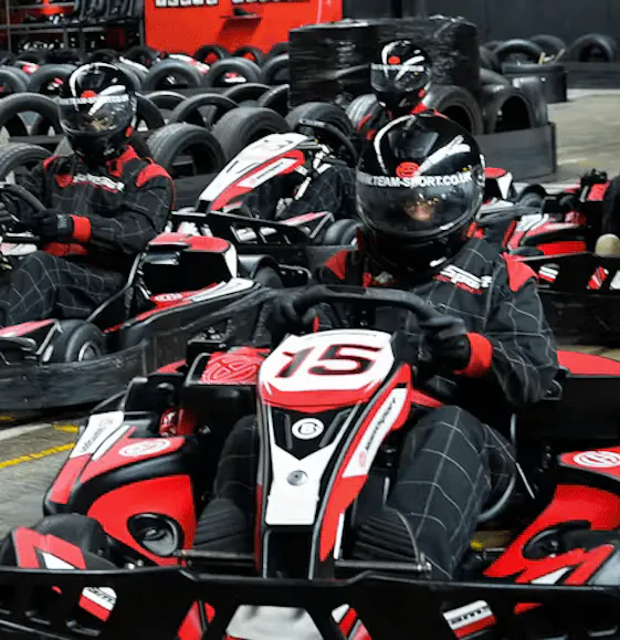 Go-Karting On TeamSport Track In Red Karts