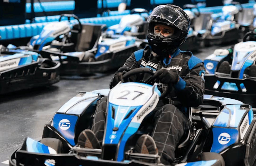 Male In Blue Go-Kart In Pits