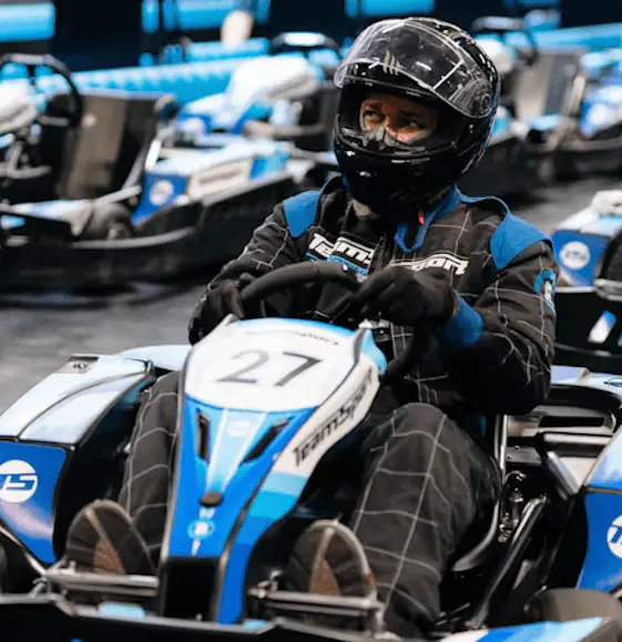 Male In Blue Go-Kart In Pits