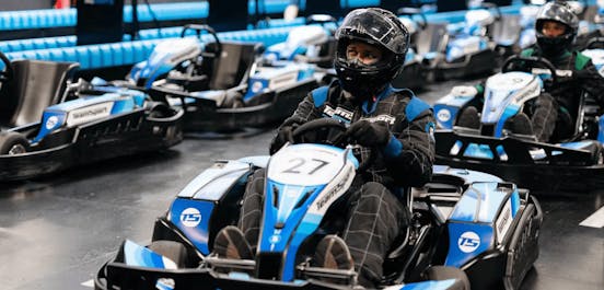Male In Blue Go-Kart In Pits