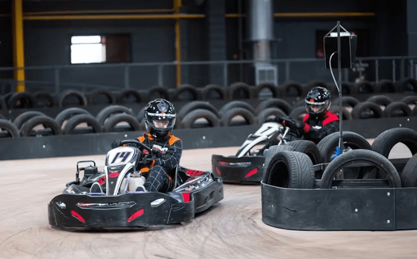 two karters in red karts