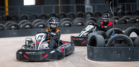 two karters in red karts
