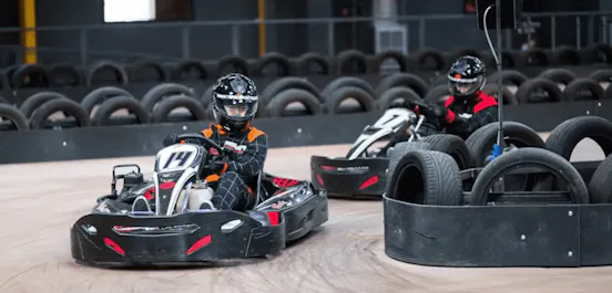 two karters in red karts