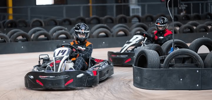 two karters in red karts