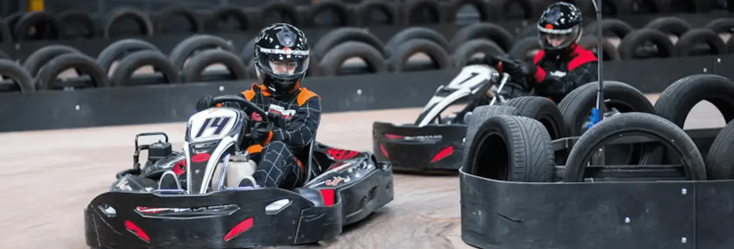 two karters in red karts