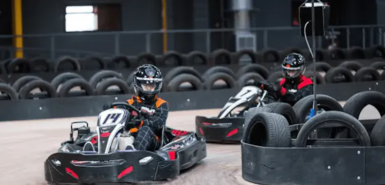 two karters in red karts