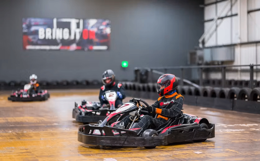 karters in red petrol karts
