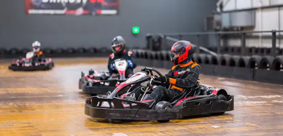 karters in red petrol karts