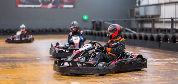 karters in red petrol karts