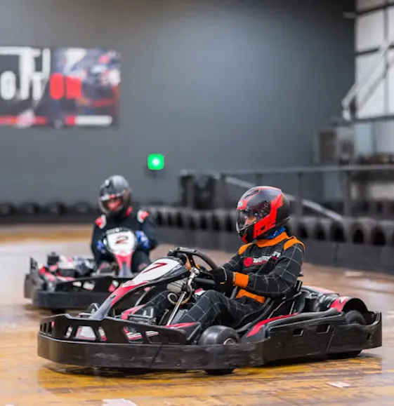 karters in red petrol karts