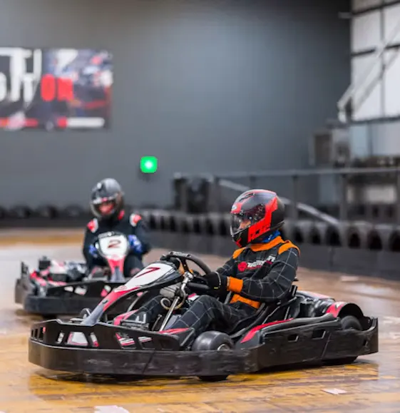 karters in red petrol karts