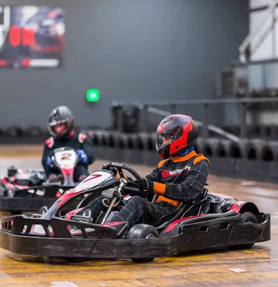 karters in red petrol karts