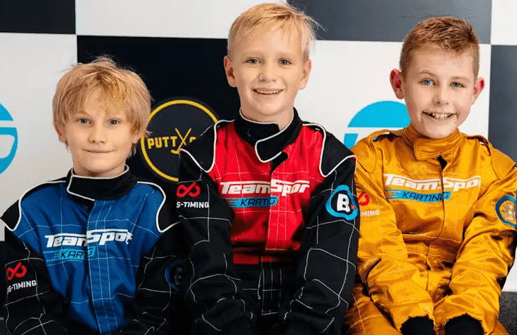 Kids sitting on podium at party