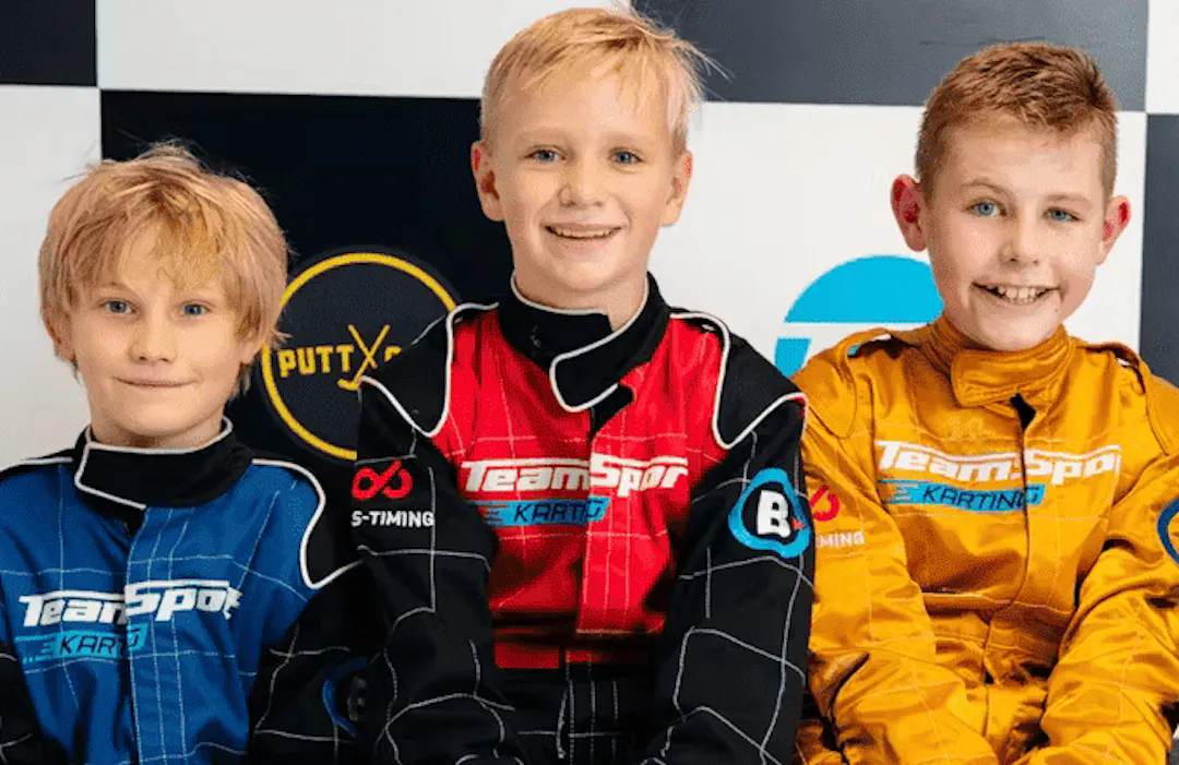 Kids sitting on podium at party