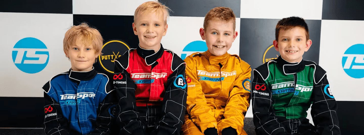 Kids sitting on podium at party