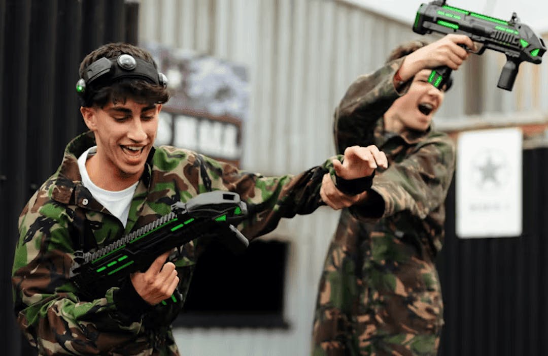 group of friends playing laser combat