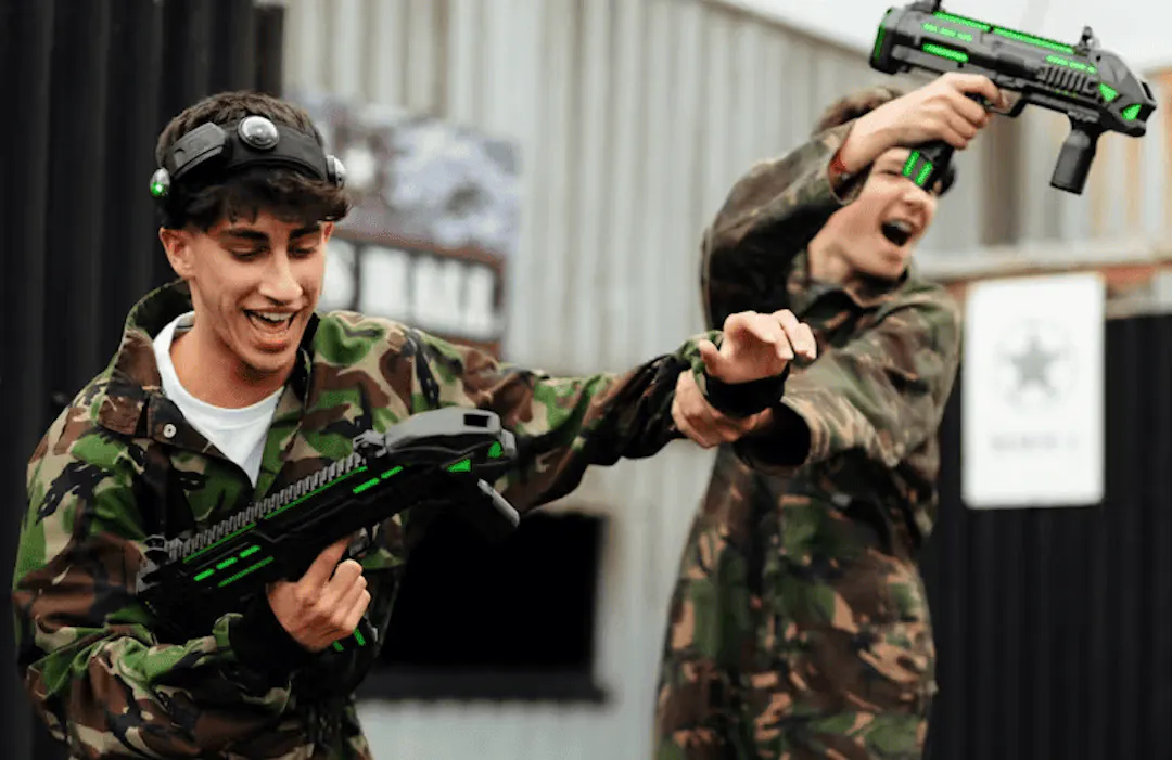group of friends playing laser combat