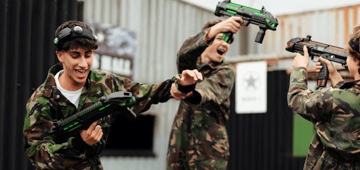 group of friends playing laser combat