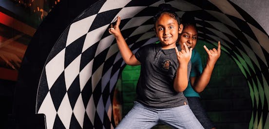 Kids Posing In A Putt Club COurse