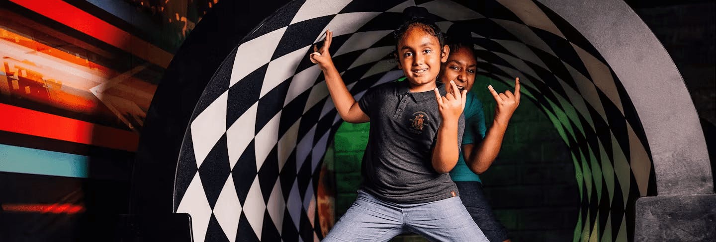 Kids Posing In A Putt Club COurse