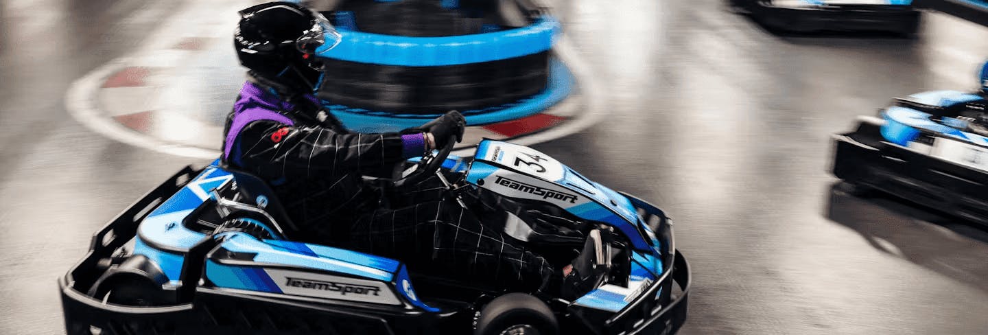 go-karter in blue electric kart
