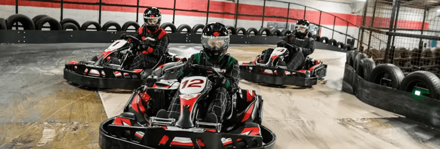 three karters in red petrol karts