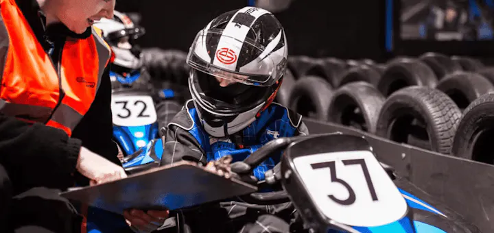 Tutor helping karter at race academy session