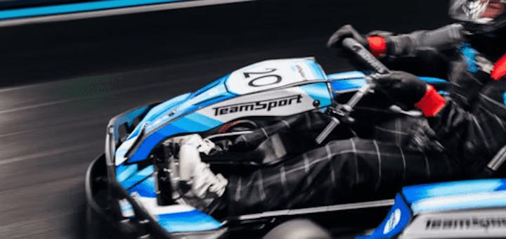 blurred image of karter in kart