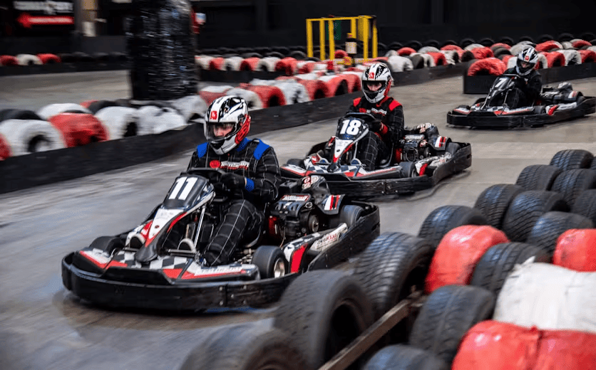 Three karters in red petrol karts