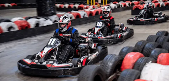Three karters in red petrol karts