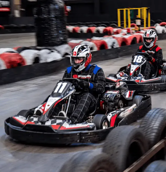 Three karters in red petrol karts