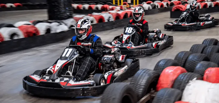 Three karters in red petrol karts