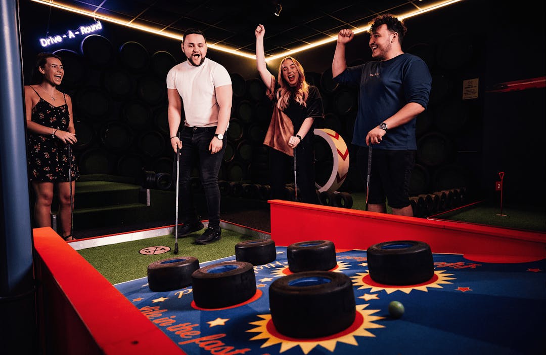 Group playing mini golf