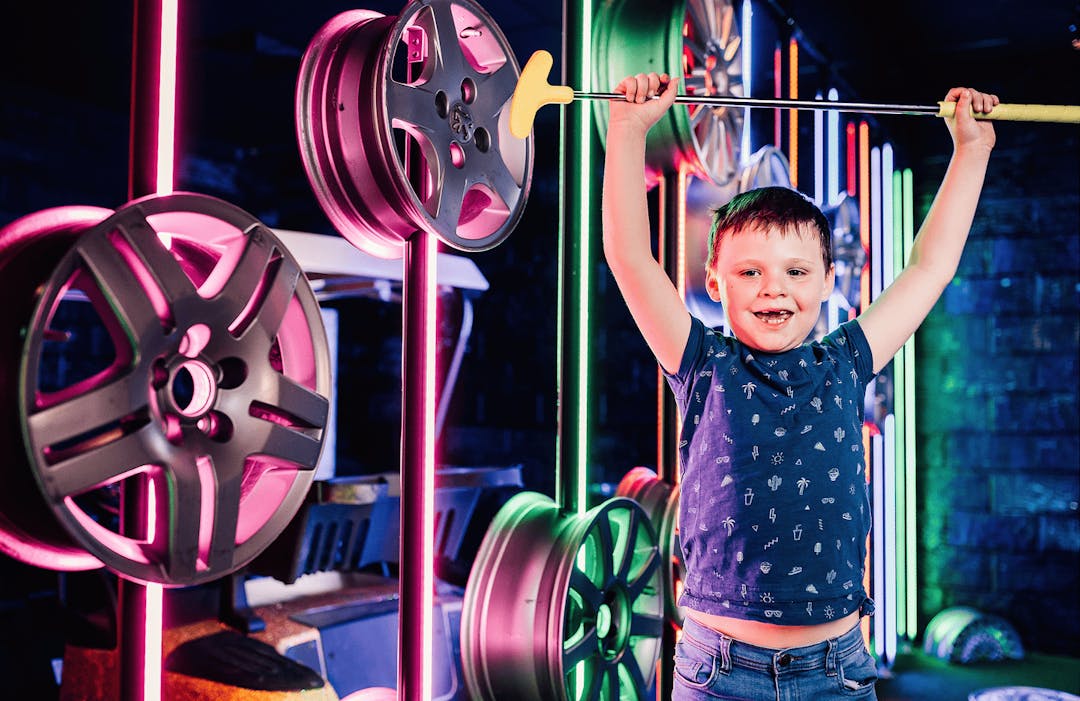 Kid cheering at putt club